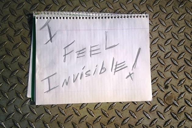 I feel invisible written on notepad