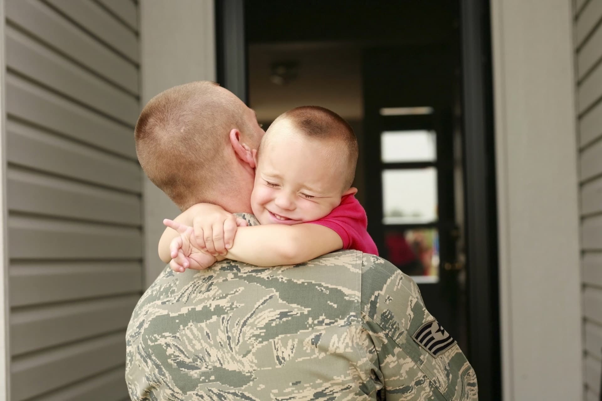 Soldier holding his child