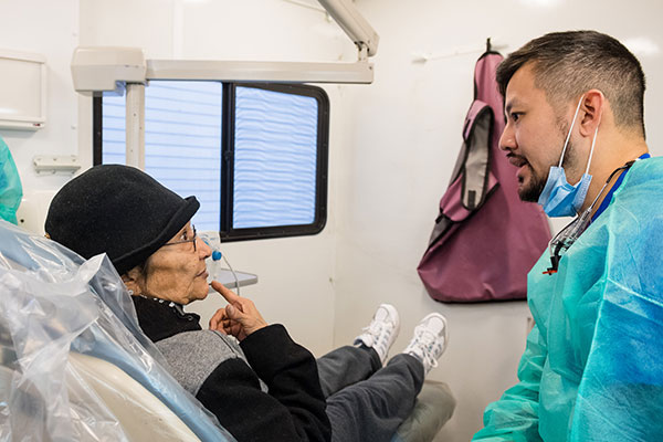 Homeless woman getting dental exam at the Resource Exchange