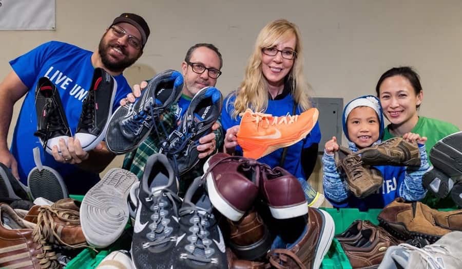 Image of volunteers with free shoes at Community Resource Exchange