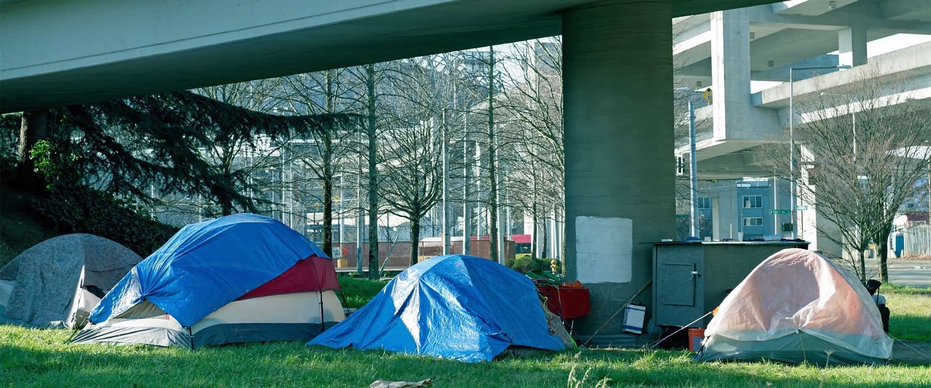 End homelessness with United Way. See the tents under bridges outside? Here's what we'd doing about them.