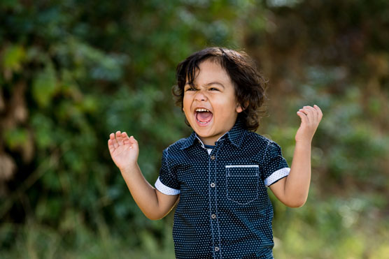 Young boy with arms in the air like he's celebrating - United Way top moments of 2017