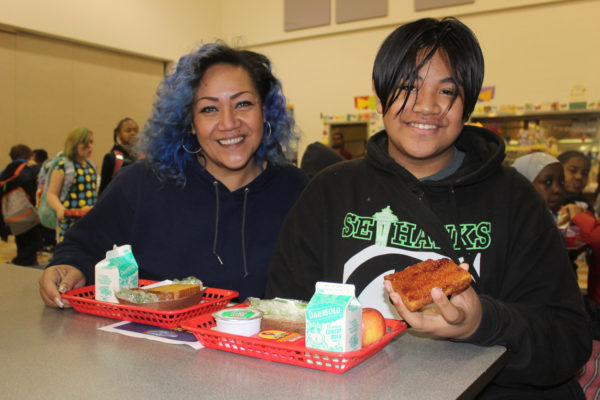 Seahawks' Russell Wilson and two volunteers at event to help feed kids