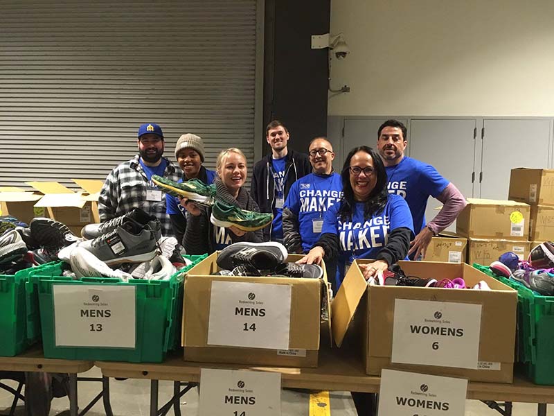 Volunteers handing out shoes at the Community Resource Exchange