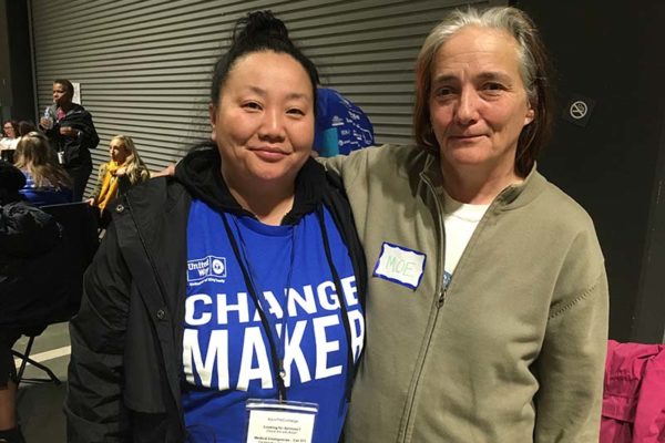 Two homeless guests at the 2017 Community Resource Exchange search for shelters in Seattle