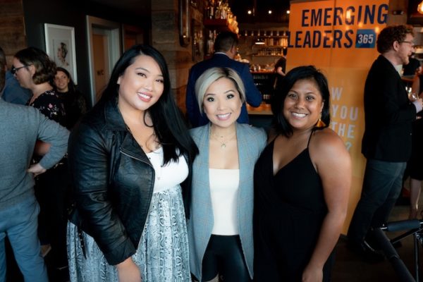 Young professionals group smile with Geekwire's Jonathan Sposato at Peddler Brewing