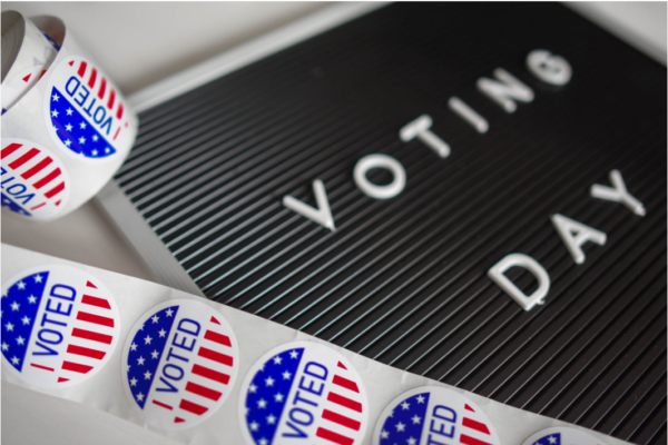 A roll of American flag stickers with the words 