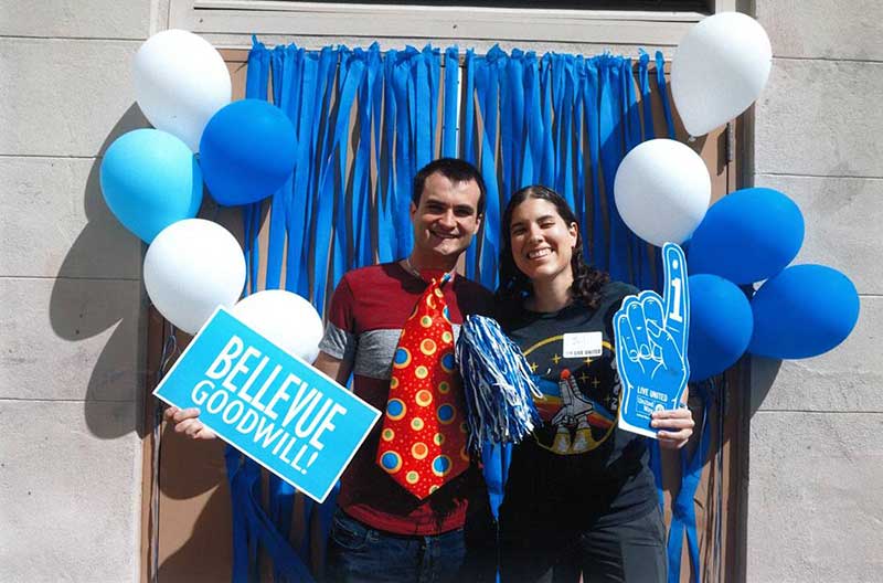 Philip and Juliana stand in front of balloons