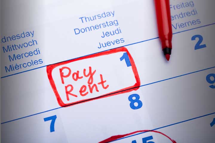 A graphic of a calendar with the words "Pay rent" marked on the first of the month.