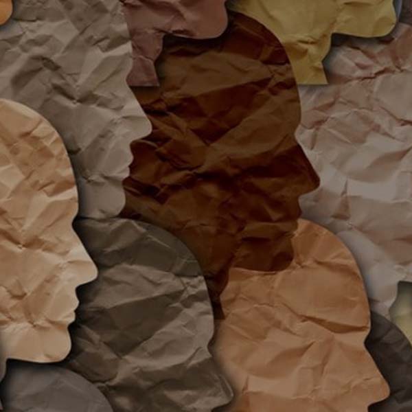 Faces made from paper looking right