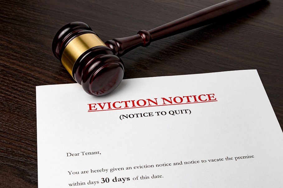A written eviction notice underneath a gavel