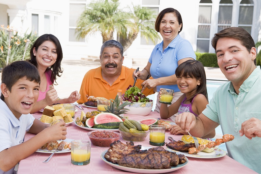 Family Enjoying A Barbeque