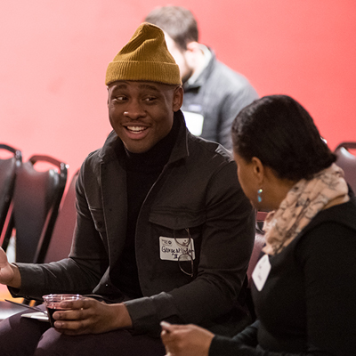 Person talking to another person at an event