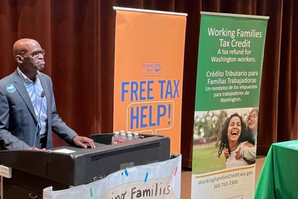Free Tax Campaign volunteer helping woman do taxes