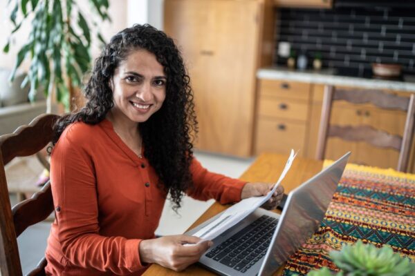 Free Tax Campaign volunteer helping woman do taxes