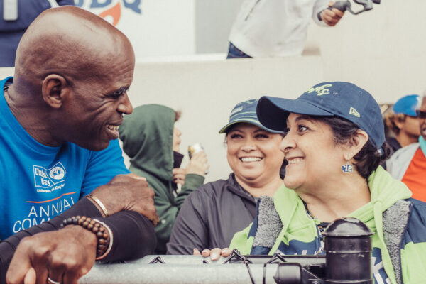 Image of Blitz the Seahawk and volunteers at Community Resource Exchange